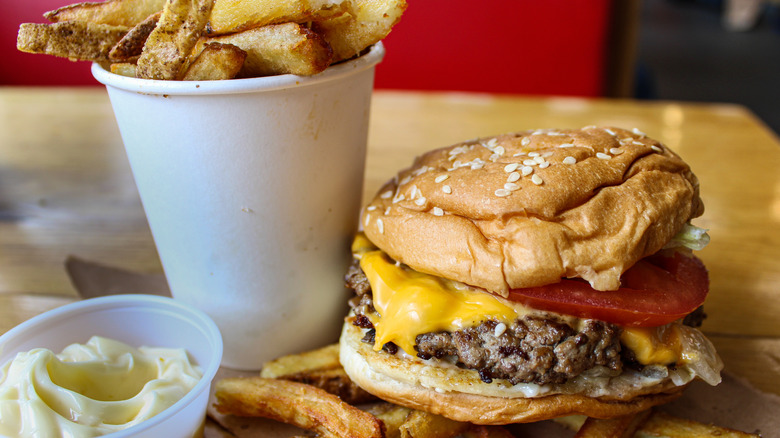 Five Guys burger and fries with cup of mayonnaise