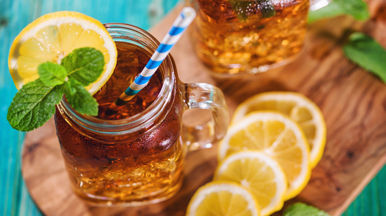 A glass of sweet tea with lemon and mint garnish