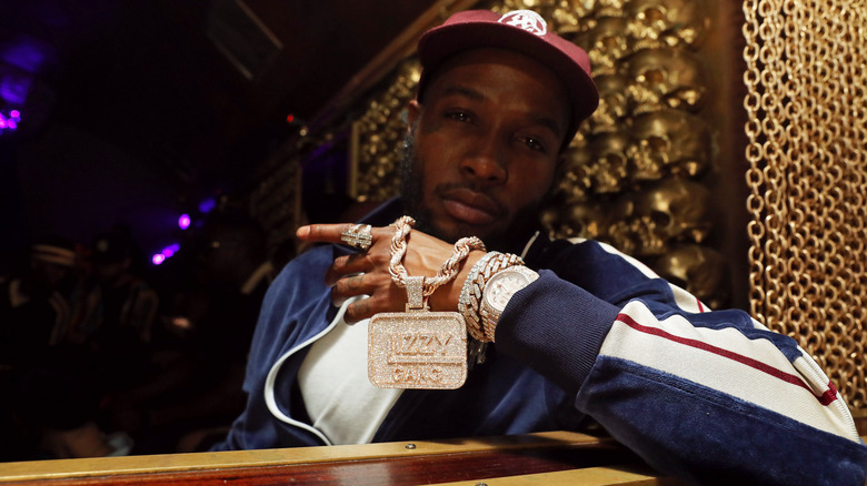 $hy Glizzy displaying Glizzy Gang pendant