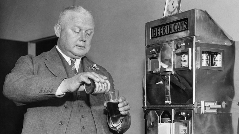 Man pouring canned beer into glass in the 1930s