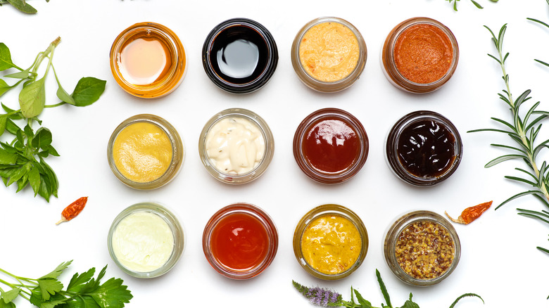 An assortment of salad dressings in small bowls