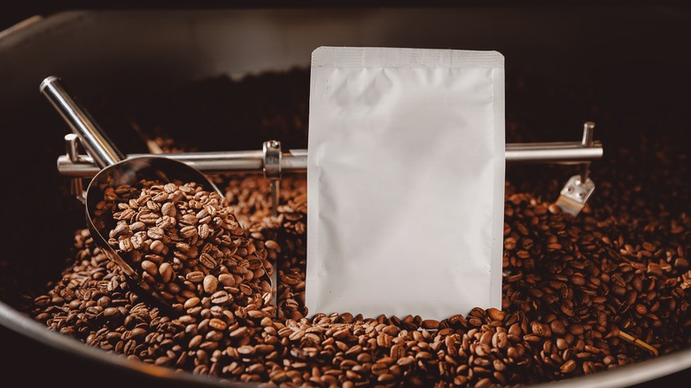 Coffee bag surrounded by beans