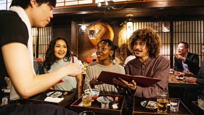 Three customers ordering food