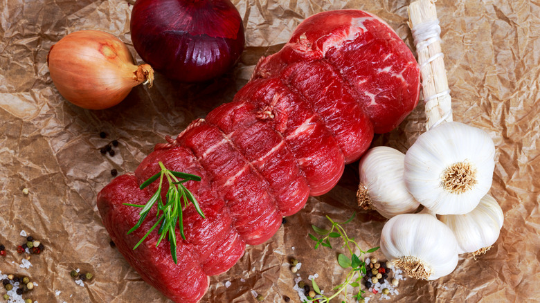 Raw beef tenderloin tied with twine