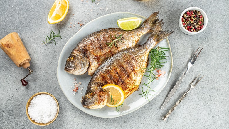 Whole fish garnished with lemon