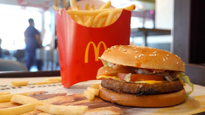 A McPlant burger on a tray next to fries.