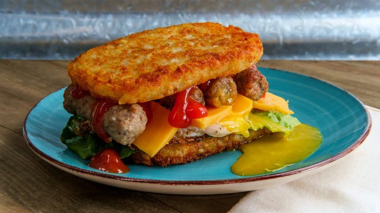 Hashbrown breakfast sandwich on plate