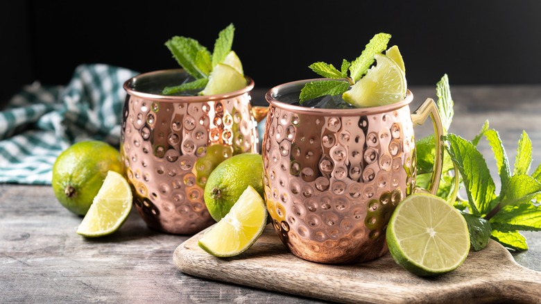 Two garnished Moscow mules in copper mugs