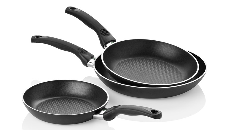 Three stacked nonstick pans 