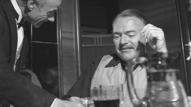 Ernest Hemingway at a restaurant 