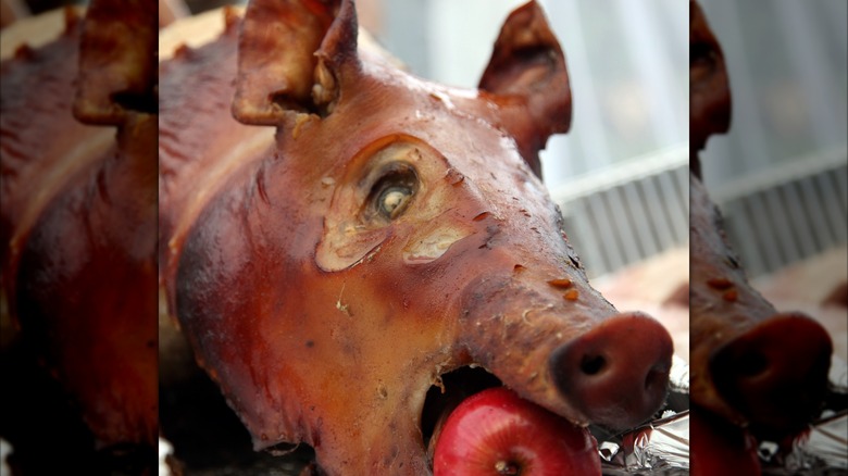 Roasted pig with an apple in its mouth