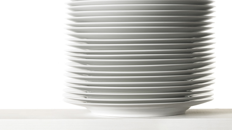 A stack of white plates