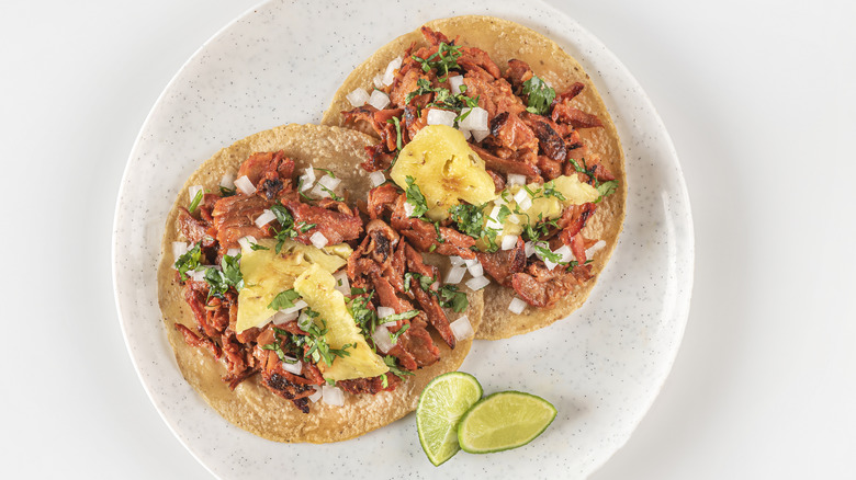 Al pastor tacos with pineapple and herbs