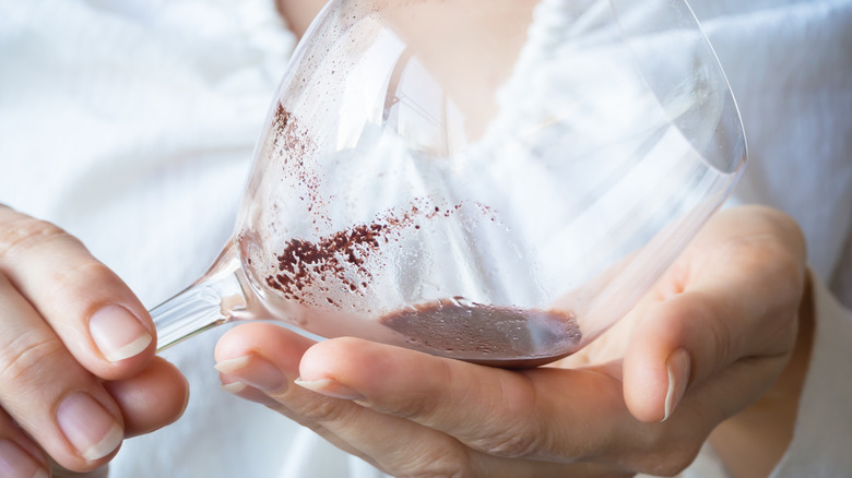 Wine sediment in a glass