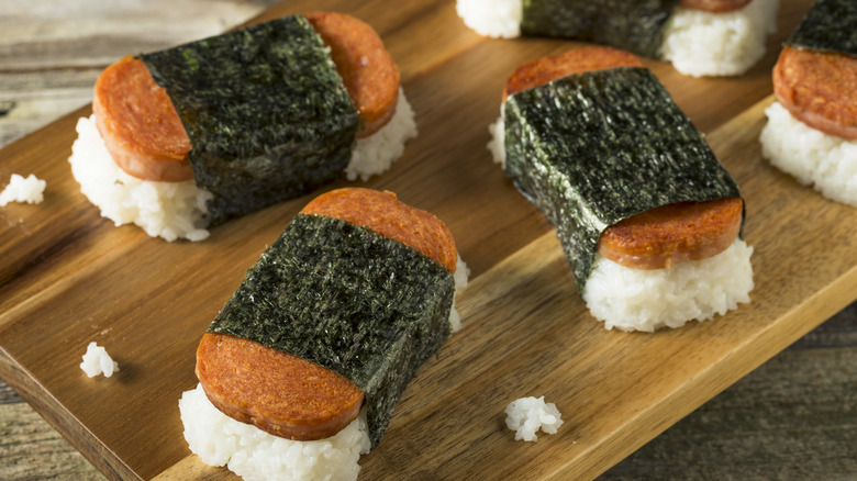 Spam musubis on wooden board.