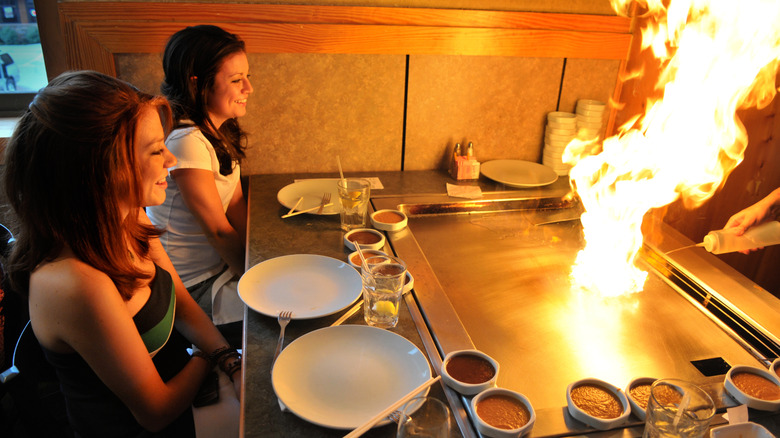 Two women at a hibachi grill