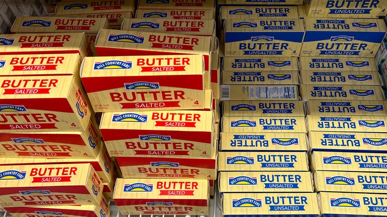 A refrigerator cabinet full of butter packages.