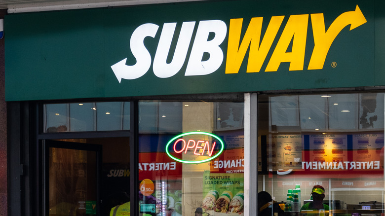 Subway storefront with an open sign