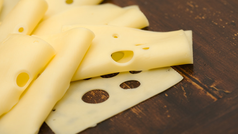 Swiss cheese slices on table