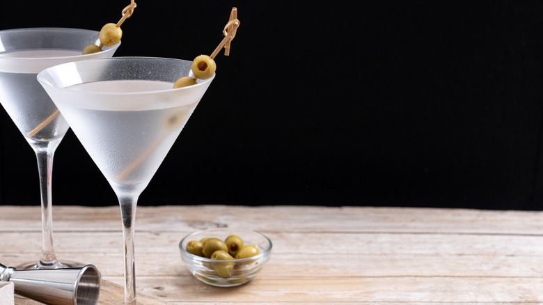 Two vodka martinis with olives