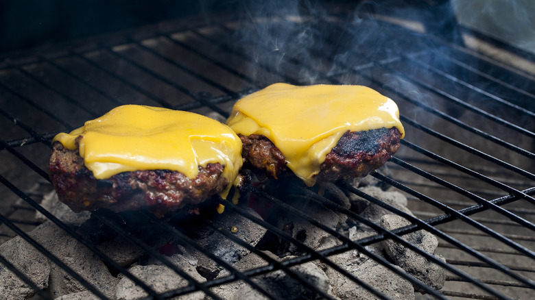 Grilling hamburgers with American cheese