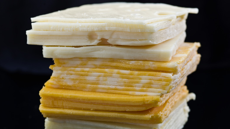 Stack of different cheese slices