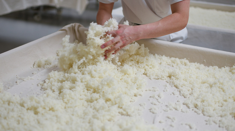 Worker spreading koji rice