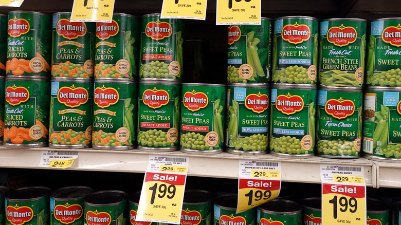 Canned vegetables on supermarket shelf