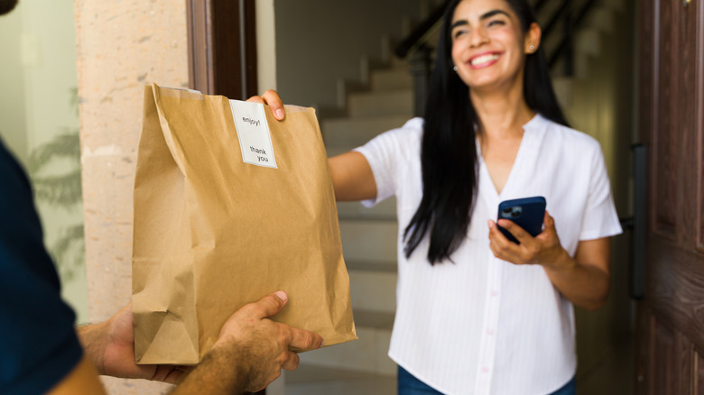 woman getting food delivery