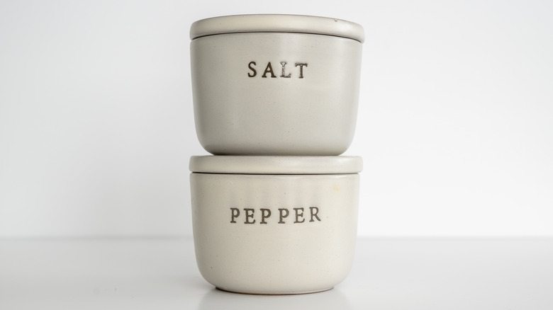 ceramic salt and pepper containers on top of each other