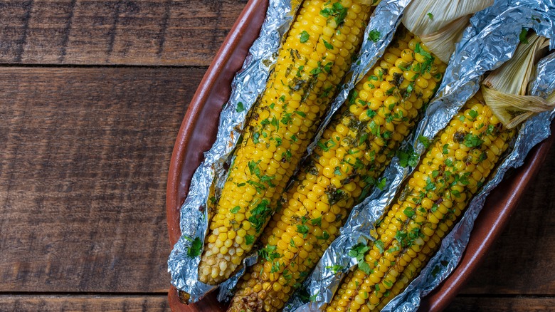 Grilled corn in aluminum foil