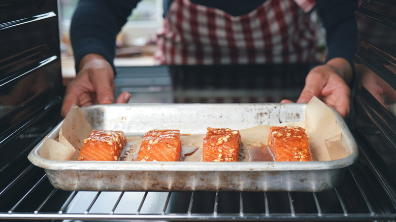 Salmon cooking in oven