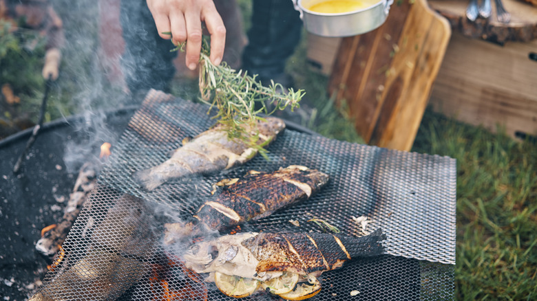 Fish cooking on a grill