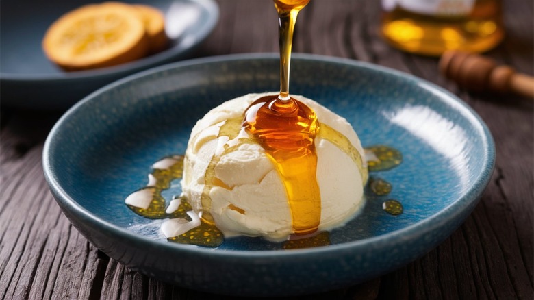 Honey pouring over warm ricotta