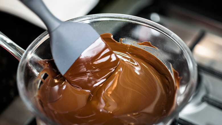 Melted chocolate in a bowl with a spatula