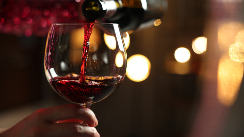 red wine being poured into glass