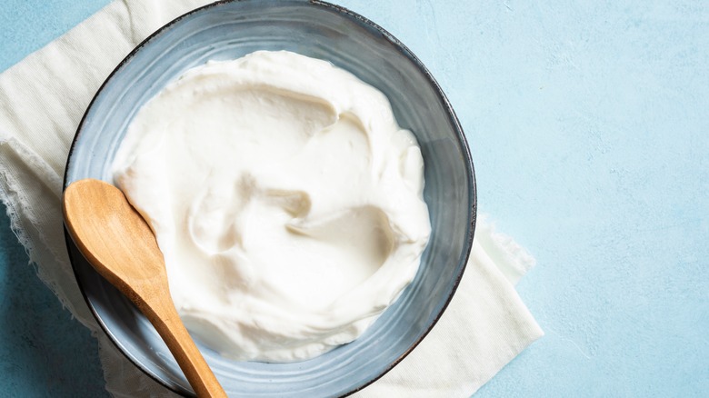 Greek yogurt with wooden spoon