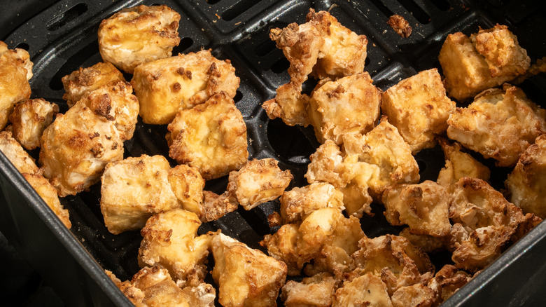 Crispy tofu in air fryer basket