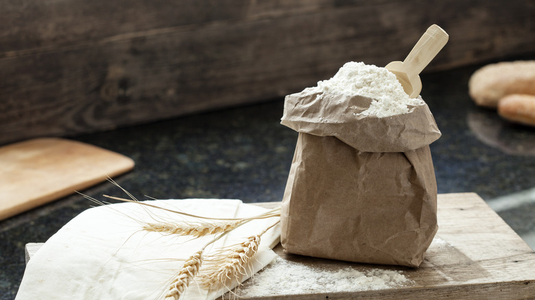 Open paper bag of flour