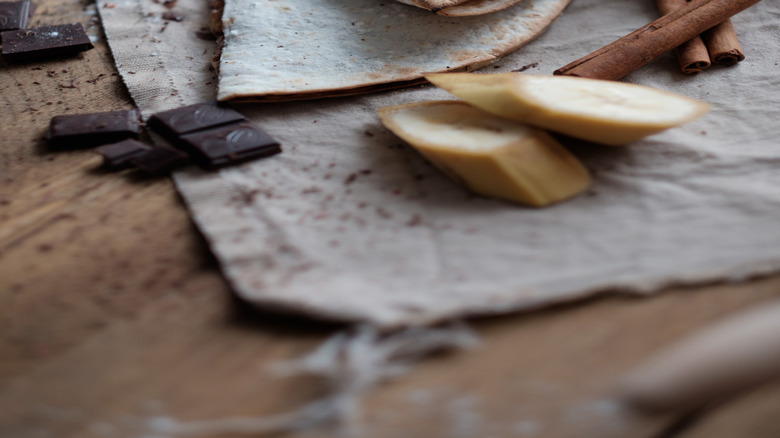 quesadillas with chocolate, banana, and cinnamon sticks