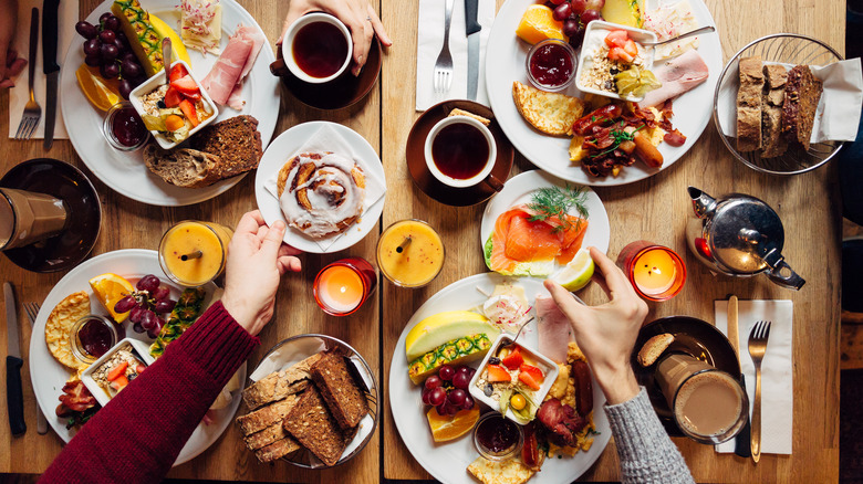 Three friends enjoy breakfast