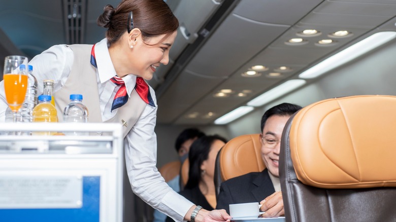 flight attendant with service cart