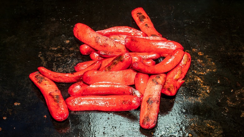 Split hot dogs on griddle