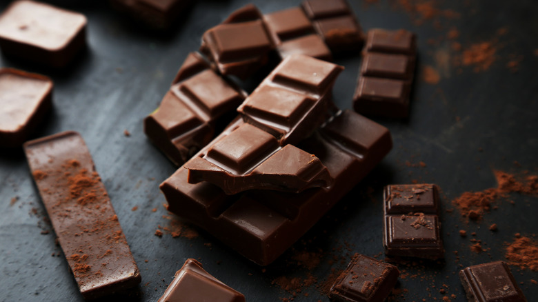 broken squares of chocolate on slate