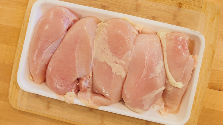 Package of raw chicken breast