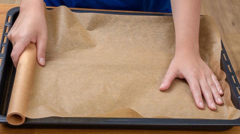 lining baking sheet with parchment paper