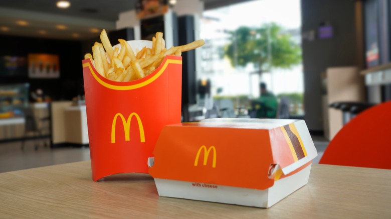 McDonald's fries and burger on a table.