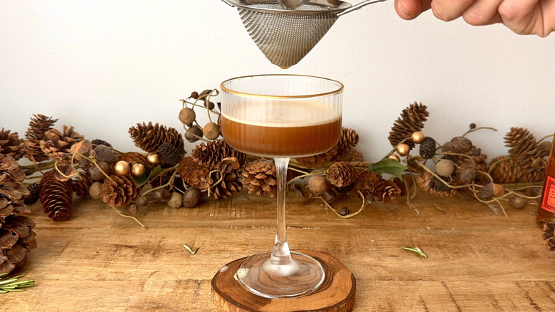 Straining espresso martini