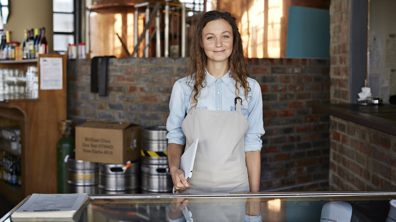 Woman in apron at a microbrewery