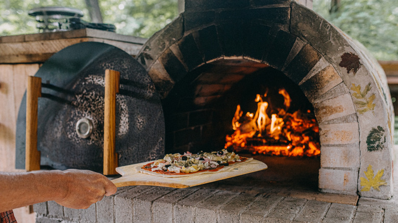 Cooking pizza in a traditional brick oven